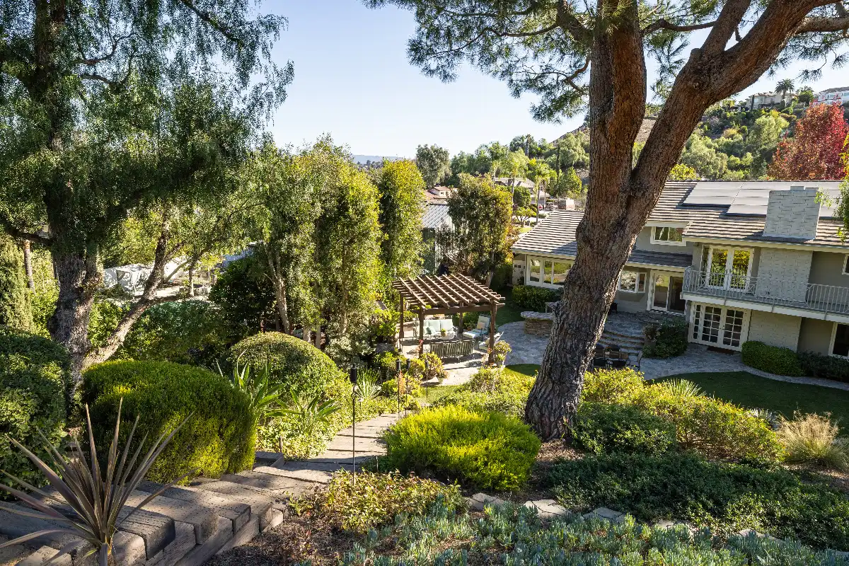 Dreamy backyard with lush landscaping in a Laguna Hills real estate listing sold by Brad Feldman top agents