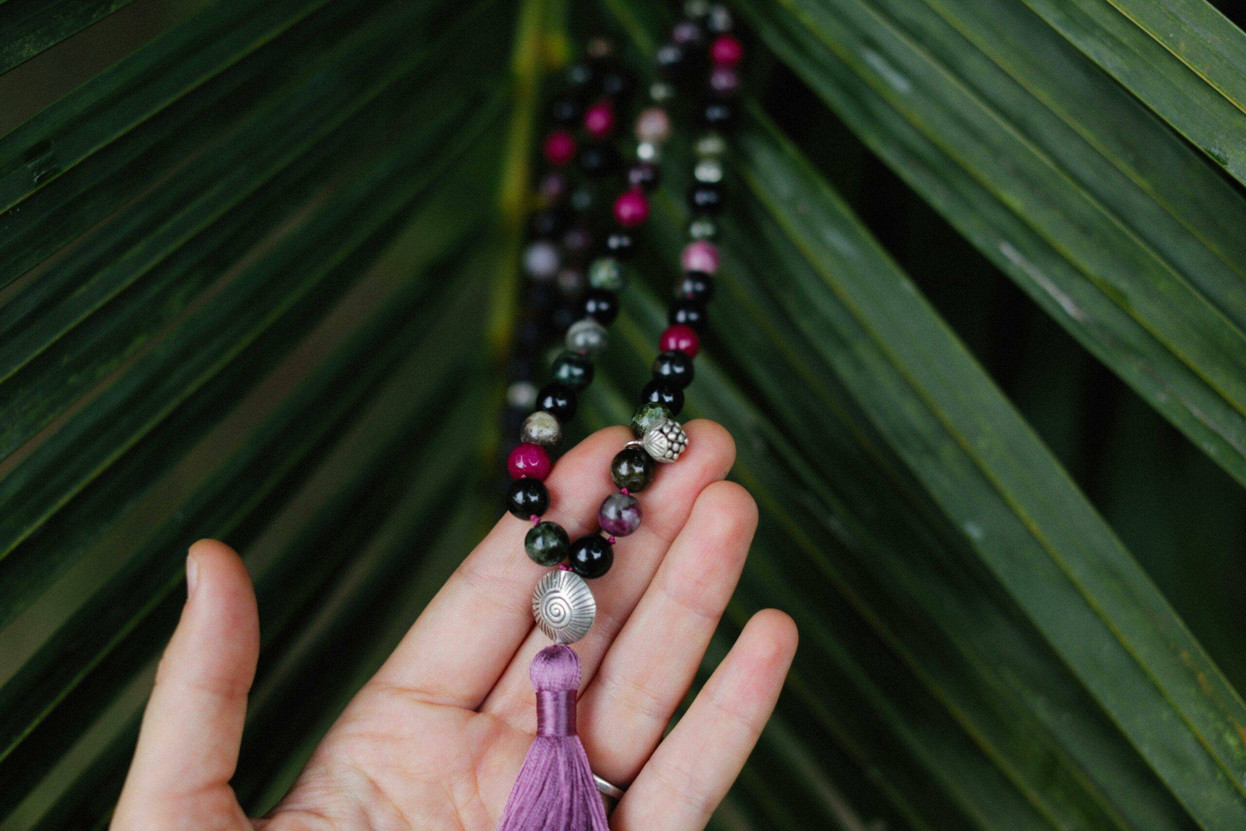 Person holding a beaded bracelet, showcasing the artisans and vendors at the Laguna Niguel Farmers’ Market