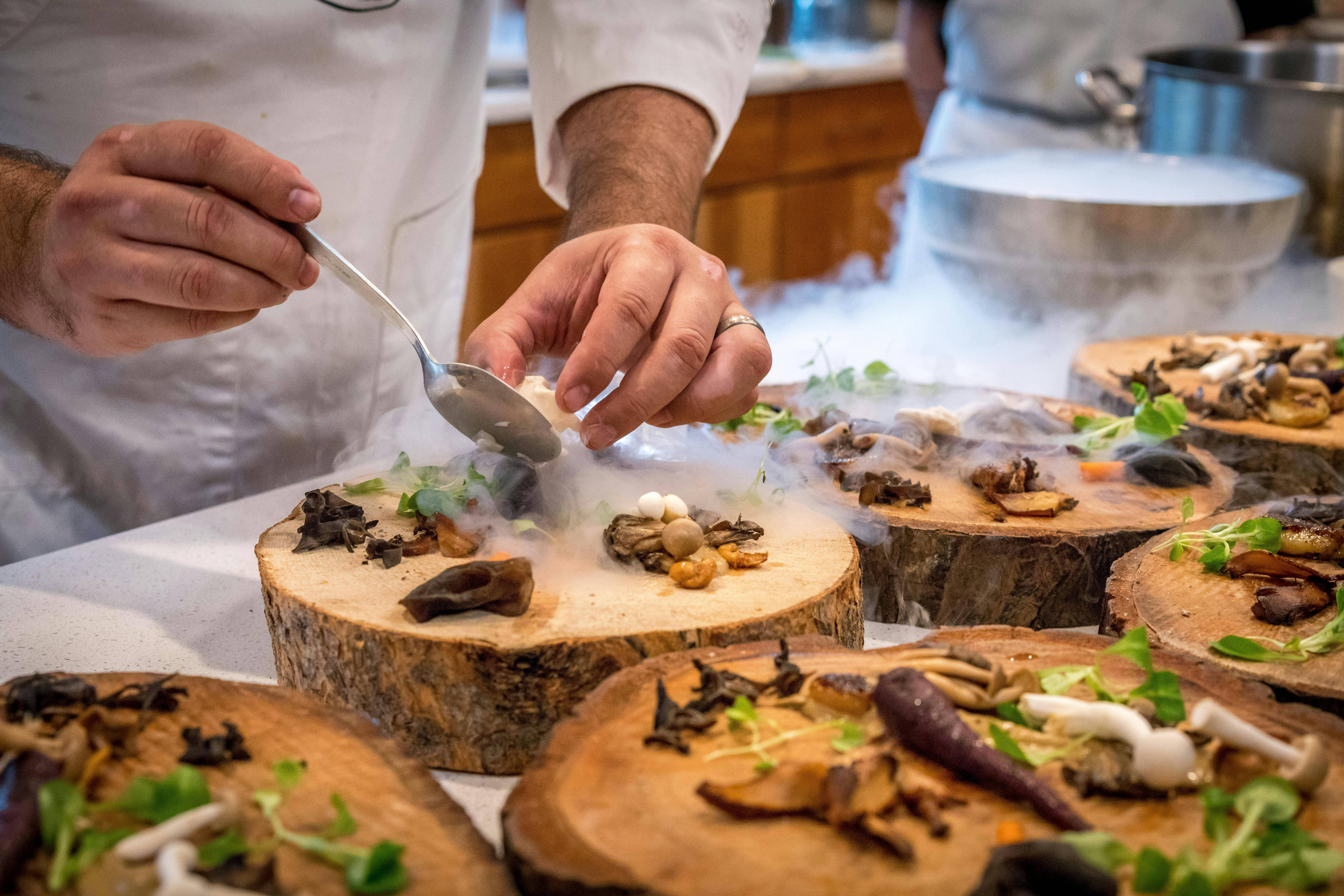 Fine dining with chef serving food at an upscale Monarch Beach Dana Point restaurant