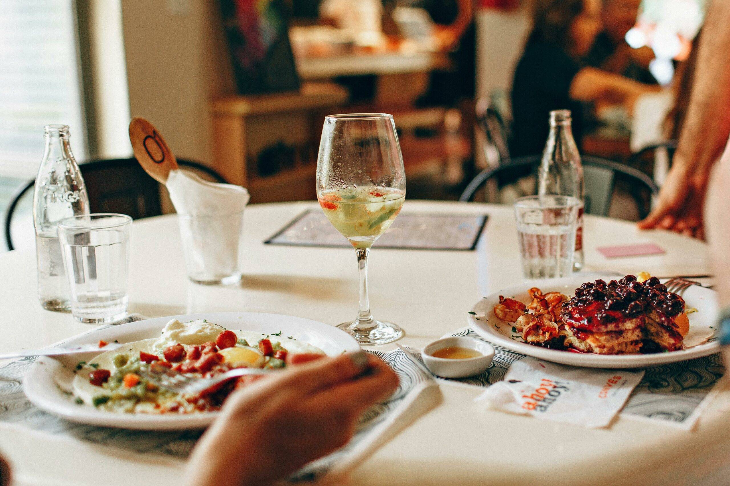People eating and drinking wine at Dana Point restaurants in 2025 by best local realtors Brad Feldman Group