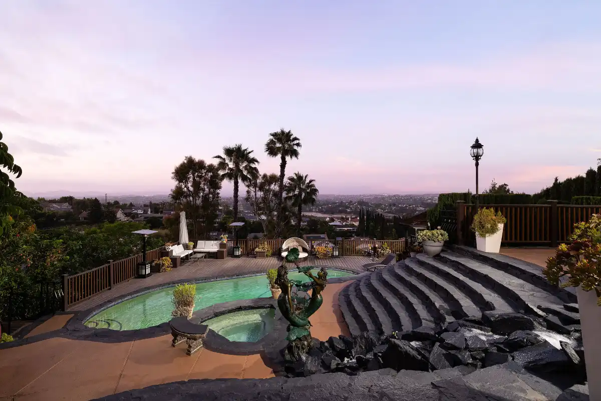 Backyard pool and views at sunset above Laguna Hills Nellie Gail Ranch real estate community