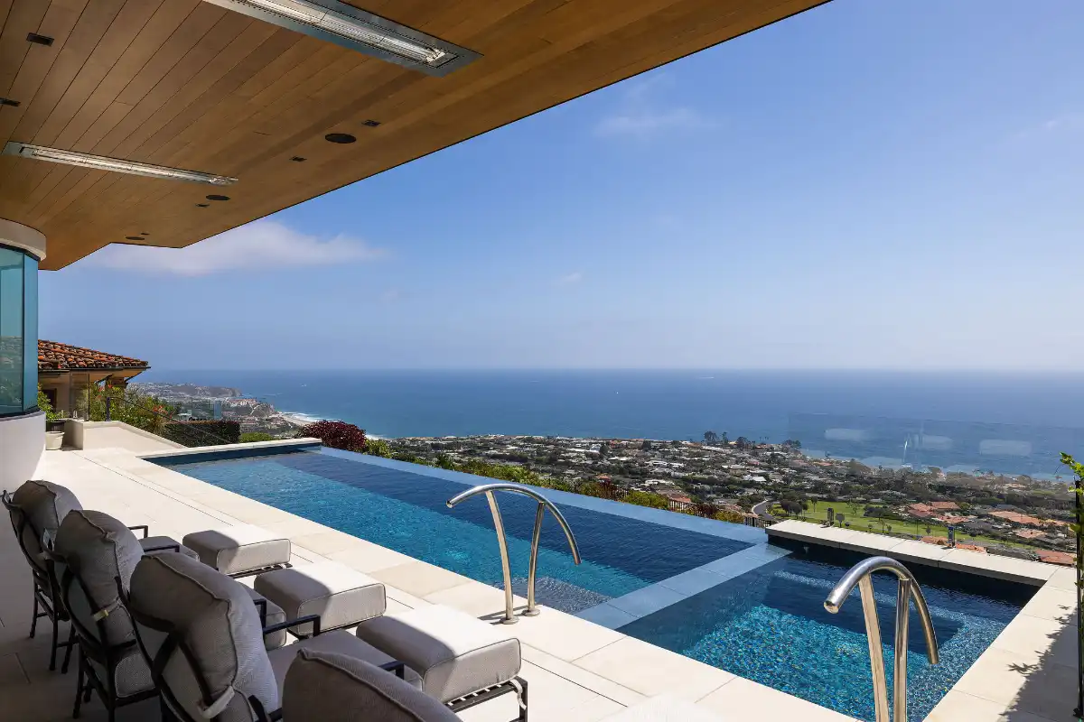 Pool with ocean views of a luxury home sold by the best Dana Point real estate agents who know when it’s a great time to buy a house