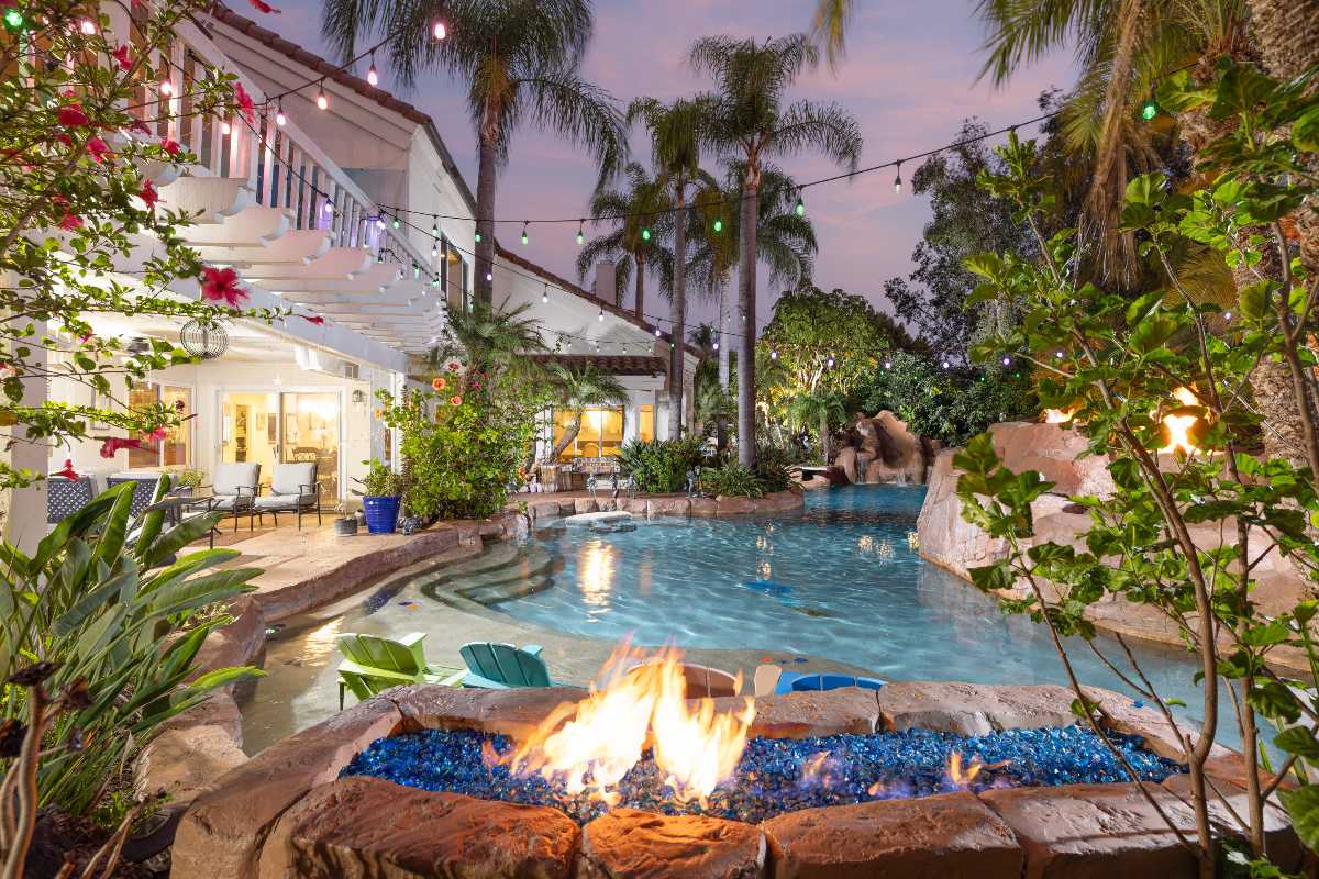 Backyard pool and spa oasis with exterior lights at a luxury home for sale in Nellie Gail Ranch, top destination for Orange County homebuyers seeking mortgage rate information