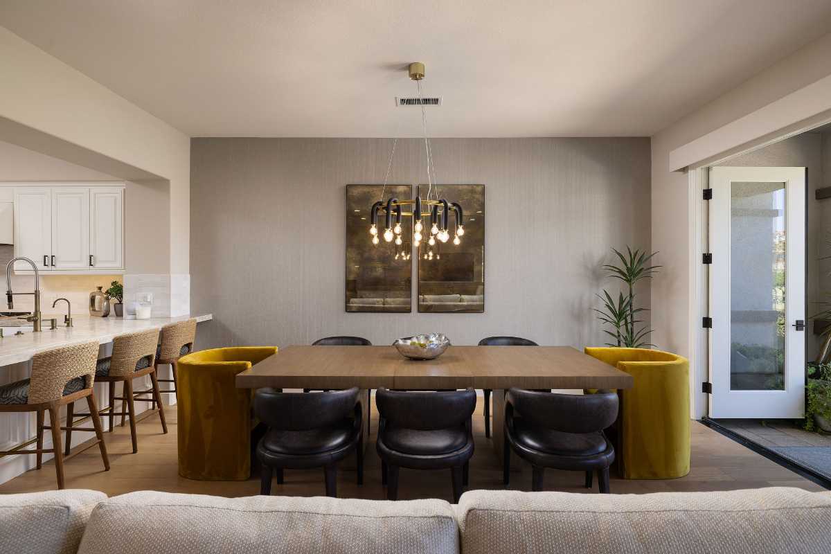 Dining room with contemporary lighting of a luxury home sold by Brad Feldman, top local realtor to navigate a buyer’s market and seller’s market